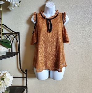 Cold shoulder blouse.